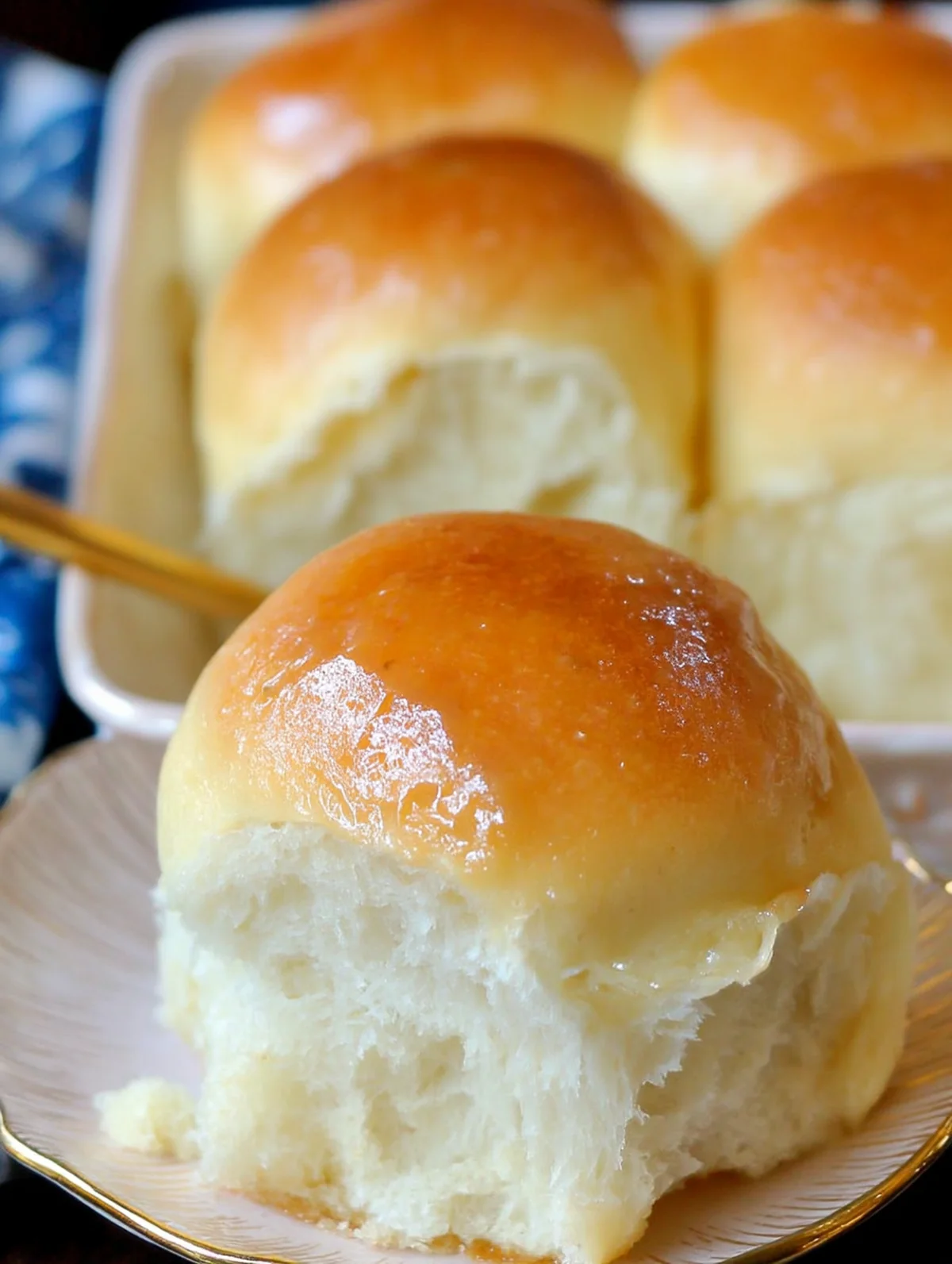 Easy dinner roll recipe dough shaped into smooth balls before baking