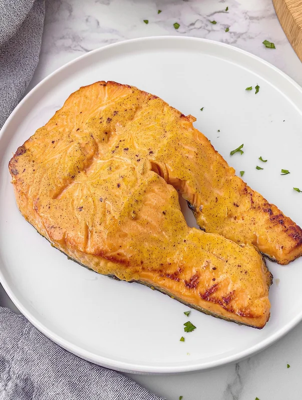 honey mustard glazed salmon air fryer in air fryer basket (delicious honey mustard glazed salmon air fryer)