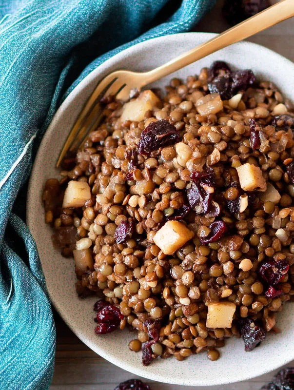 Ingredients for lentil and cranberry salad variations arranged on a kitchen counter (LENTIL AND CRANBERRY SALAD VARIATIONS)