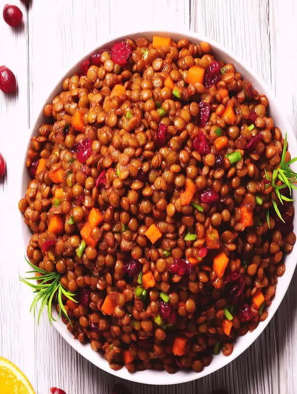 Serving suggestion for lentil and cranberry salad variations on a rustic table (Lentil And Cranberry Salad Variations)