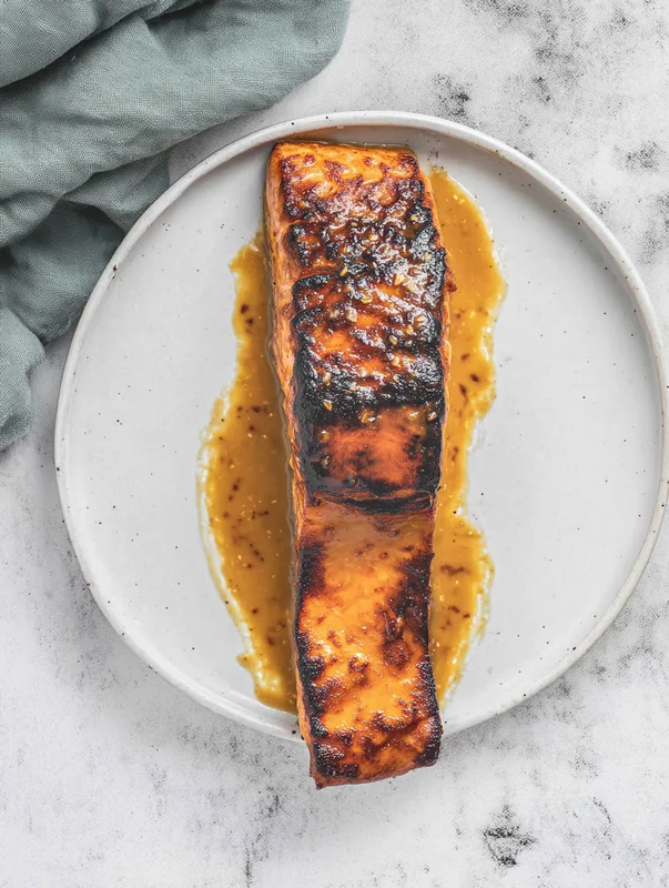 pan seared honey mustard salmon served with fresh herbs and lemon (nutritious pan seared honey mustard salmon)